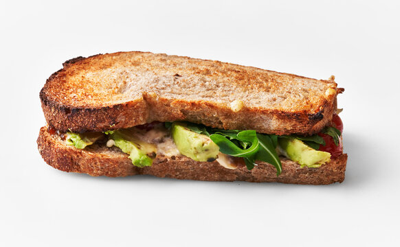  Single avocado sandwich over white isolated background