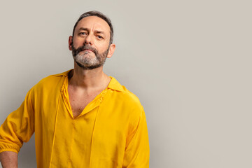 Stylish handsome grey bearded senior on casual clothes