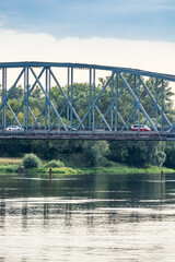 Fototapeta na wymiar Torun, Poland - August 11, 2021. Jozef Pilsudski bridge over Wisla river in Summer