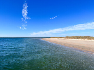Water laps up on the beach of Shackleford Banks on the Outer Banks of North Carolina