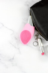 Sonic facial brush with other daily face treatment, lifestyle, copy space