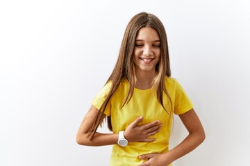 Young brunette teenager standing together over isolated background smiling and laughing hard out...