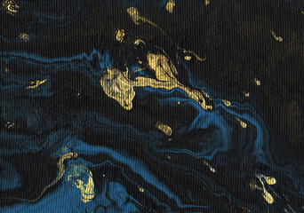 Abstract black-blue-gold watercolor graphite background. Hand-painted texture, splashes, drops of paint, paint smears. Best for the print, fabric, poster, wallpaper, cover and packaging.