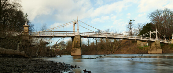 Panoramic view of old iron bridge over a river