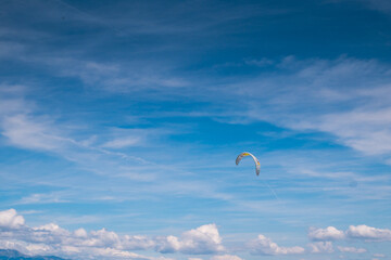 Parachute of the kitesurfer against blue sky