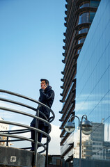 young man in suit using mobile phone