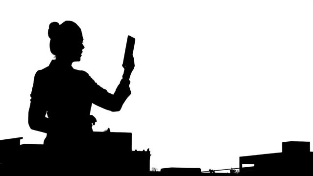 Hard Silhouette of Businesswoman using tablet