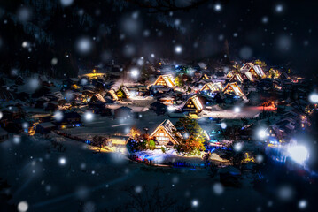 Fototapeta na wymiar Shirakawago Light Up Illumination Event in Winter Snow at Night, Japan