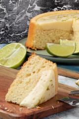Piece of lemon cake on cutting board. Selective focus.