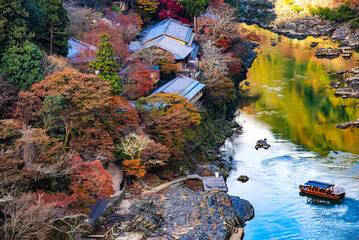 Katsura River Boat Ride along Hozugawa River in Autumn, Arashiyama, Kyoto, Japan