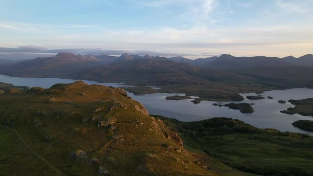 Aerial View Of Loch Maree And Beinn Eighe Mountainscape In Scotland. Dolly Forward Rising Tilt Down