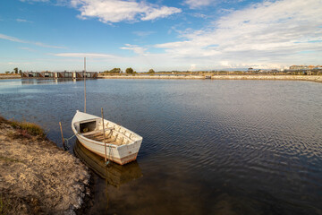 small wooden boat moored in the riverside area of ​​the city of Aveiro in Portugal