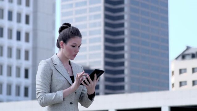 Stressed American Businesswoman working on tablet