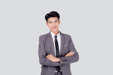 Obraz na płótnie Canvas Portrait businessman in suit with crossed his arms standing isolated on white background, young asian business man is manager or executive having confident is positive with success.
