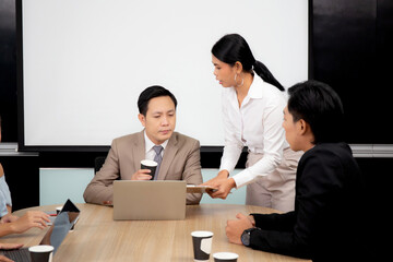Team asian business group meeting conference about marketing and finance with ceo at the office, secretary report financial with manager or boss for planning strategy, indoor, business concept.