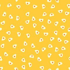 Seamless pattern with fried eggs. Abstract pastel pattern with eggs. Random, chaotic yellow background with cute omelette.