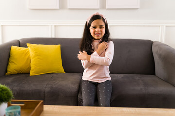 Studio shot of a kid with itchy arms