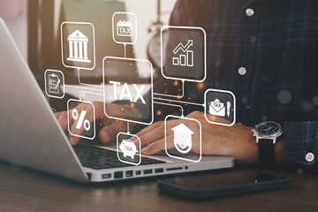Busines using a computer to complete Individual income tax return form online for tax payment....