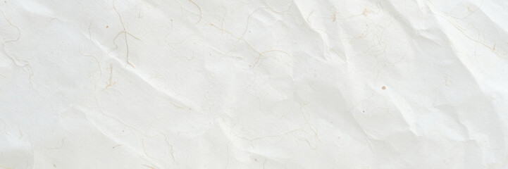 Obraz premium Brown wrinkled paper, Japanese handmade mulberry crumpled paper texture background, banner, wallpaper, poster