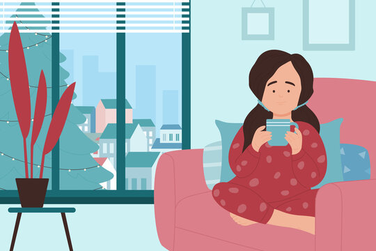 Girl holding hot drink vector illustration. Cartoon cute little child in pajamas sitting by home window with cold winter weather in soft cozy armchair, kid with mug in hands. Stay warm concept