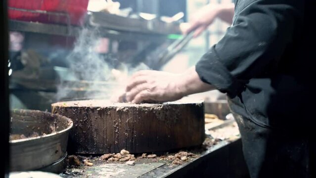 Man cooking meat for delicious street tacos 