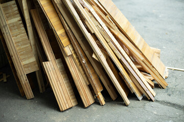 Broken parquet. Waste after repair. Boards from floor. Construction debris on street.