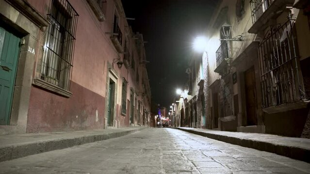 Narrow street in the town at night 