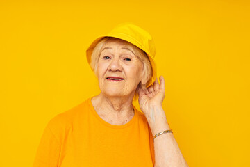 Portrait of an old friendly woman posing face grimace joy isolated background