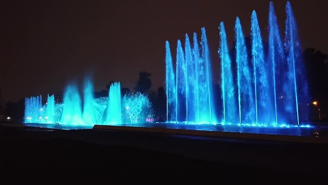 Magical water circuit with colorful water fountains show spectacle during night in Miraflores Lima Peru