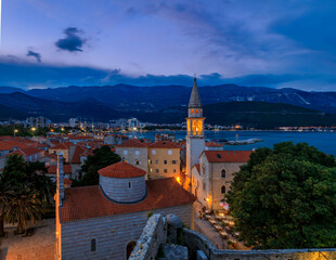 Obraz premium Budva Old Town with Holy Trinity church from the Citadel in Montenegro at sunset