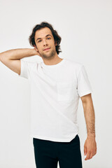 handsome man in a white T-shirt hand gesture isolated background