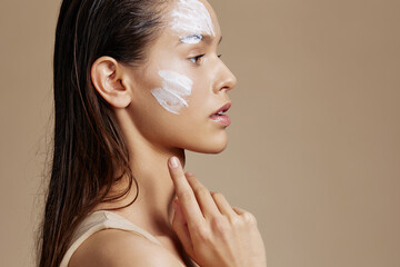 portrait woman face mask cream clean skin facial scrub beige background