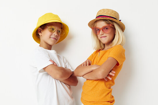 boy and girl wearing hats fashion glasses posing friendship fun