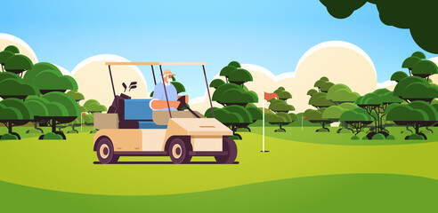 Fototapeta na wymiar senior man driving buggy on golf course active old age concept horizontal