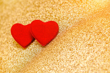 Heart symbol on a gold shiny background
