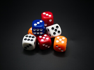 Mixed color dice on black background