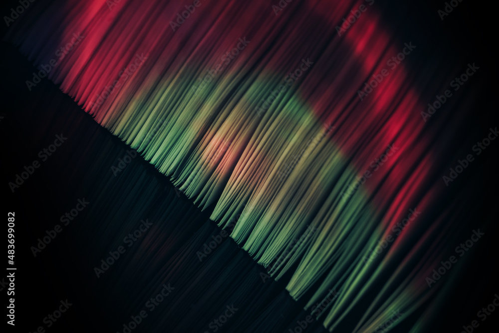 Aufkleber close up beautiful book pages in the multi color light on a night. background pattern for design. ma