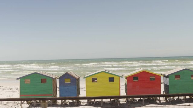 Walking next to colored houses in Muizenberg Beach, Soutk Africa
