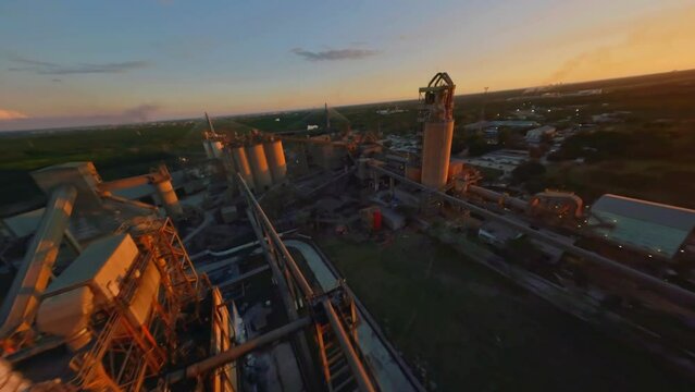 Unique perspective of an industrial cement plant; FPV drone flight