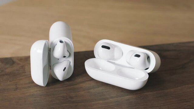 Bluetooth earphone. Opening the charging case. portable device. Wireless headphones.