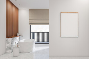 Fototapeta na wymiar Bright bathroom interior with empty white poster, bathtub, panoramic window