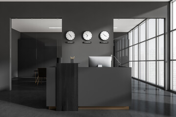 Obraz na płótnie Canvas Reception interior desk with computer and clocks, meeting room and window