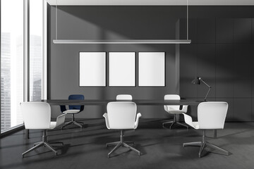 Business room interior with seats and table, lamp and window, mockup posters