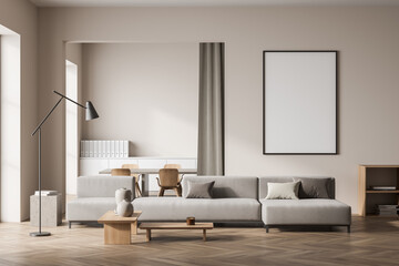 Bright living room interior with empty white poster, sofa