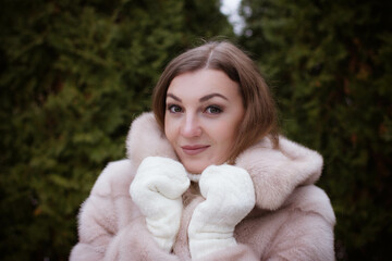 portrait of a girl in winter in a fur coat