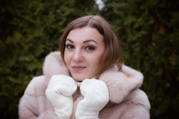 portrait of a girl in winter in a fur coat