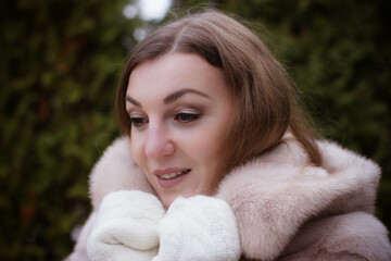 portrait of a girl in winter in a fur coat