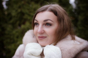 portrait of a girl in winter in a fur coat