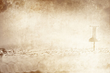 Background for travel concept. An old sheet of paper with a map silhouette with a compass and directions.