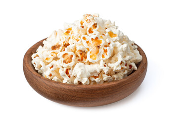 Popcorn in the wooden bowl, isolated on white background.